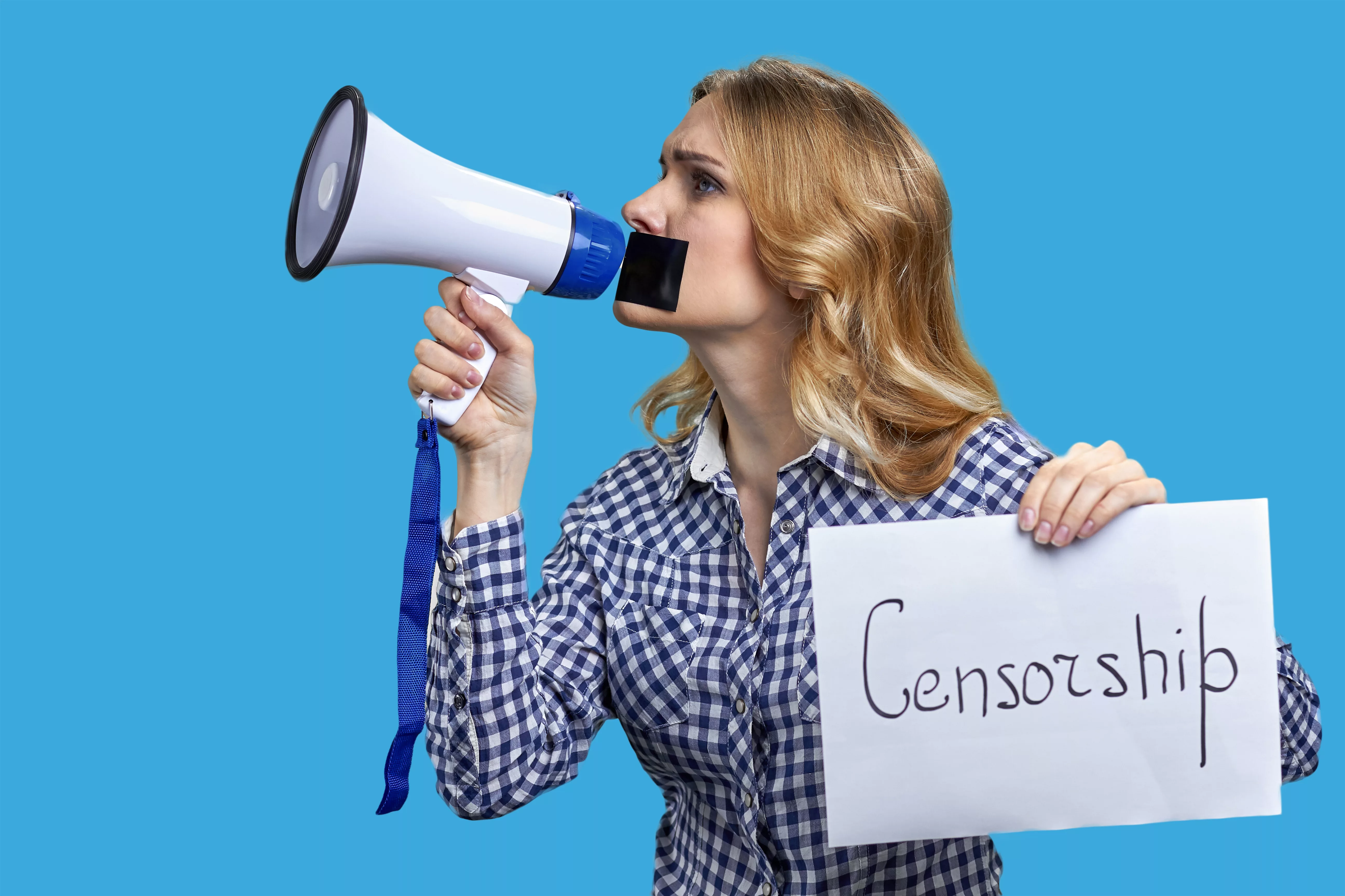 young-blonde-woman-holding-megaphone-and-banner-with-censorship-inscription