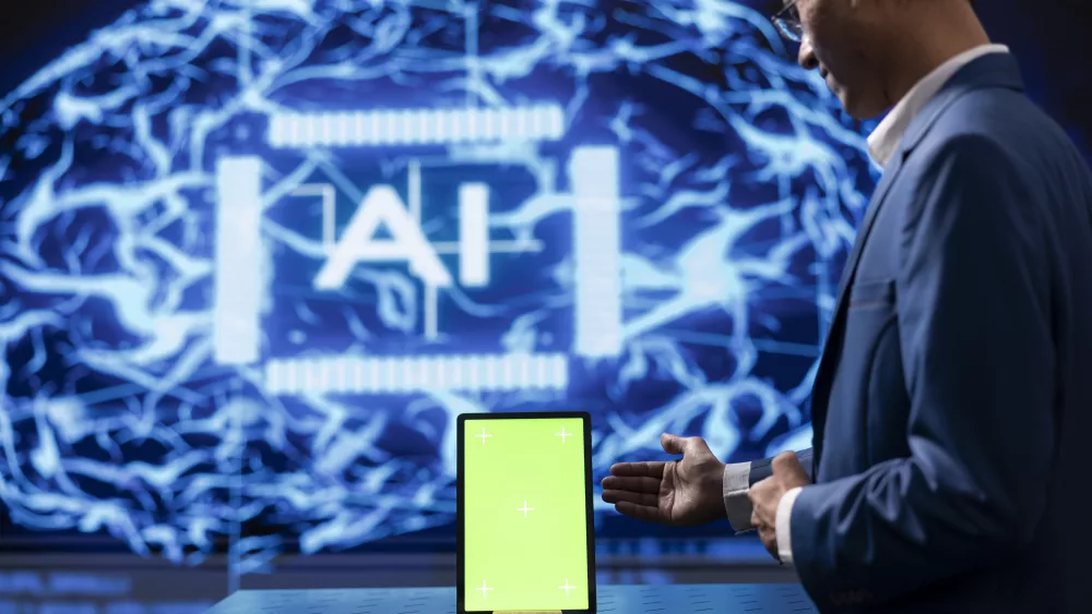 startup-employee-looking-over-green-screen-tablet-using-ai-software