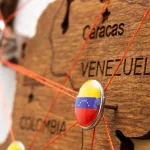 venezuela-flag-pins-and-red-thread-for-traveling-a-2023-11-27-05-16-53-utc