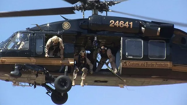 640px-cbp_rescues_illegal_immigrant_from_steep_cliff_air_and_marine_blackhawk_-_borstar_agents_integrate_efforts