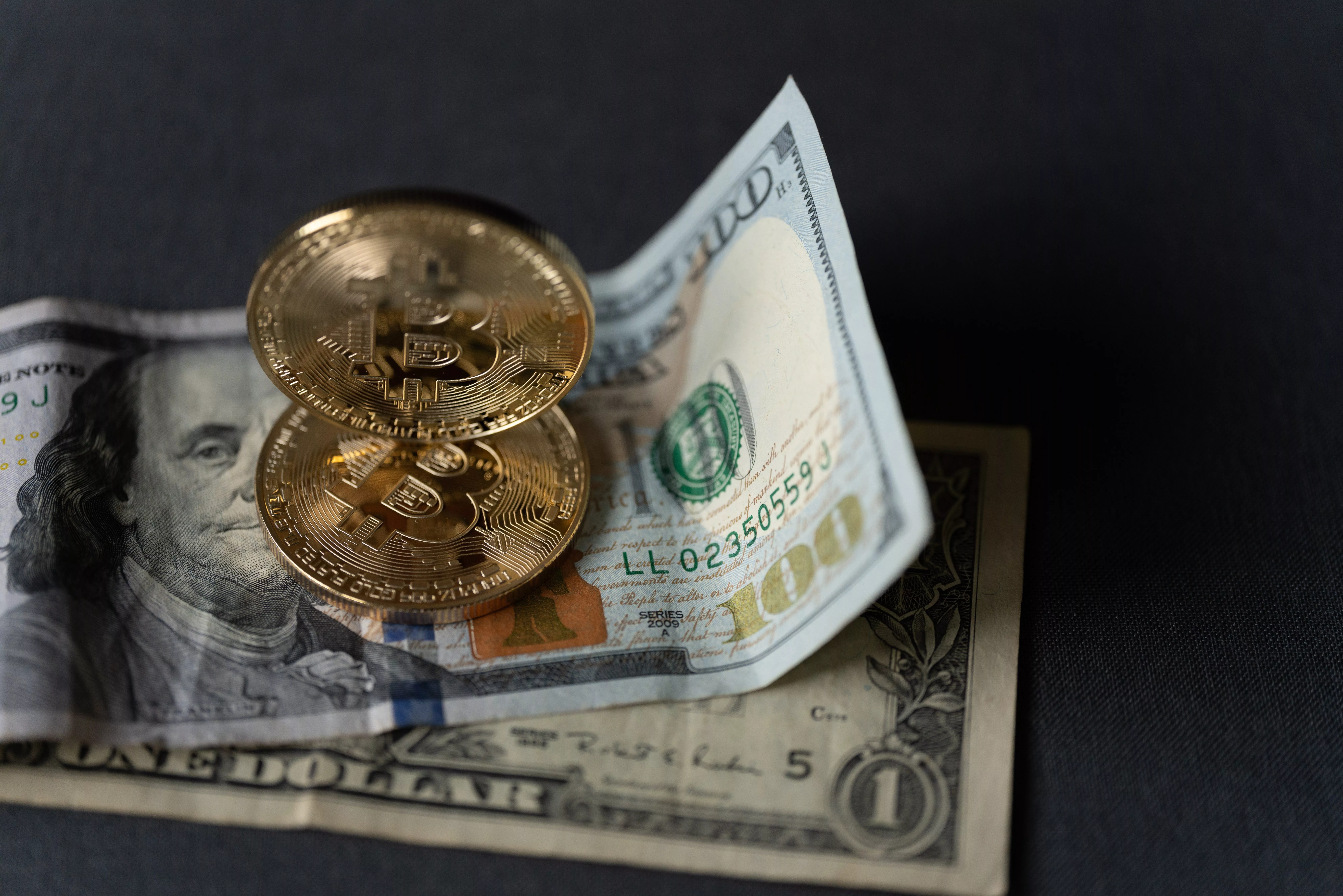 golden-coin-with-bitcoin-symbol-and-dollar-banknot-2023-11-27-05-26-08-utc