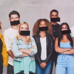 young adults with tape over their mouths