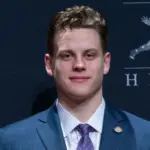Quarterback Joe Burrow of the LSU Tigers winner of the 85th annual Heisman Memorial Trophy poses with trophy at the Marriott Marquis Hotel New York^ NY - December 14^ 2019