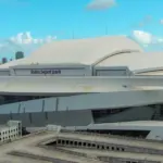 Aerial shot of LoanDepot Park with skyscrapers and office buildings in the city skyline^ lush green palm trees and cars on the street in Miami Florida USA Miami Florida USA - 11 -12-2024