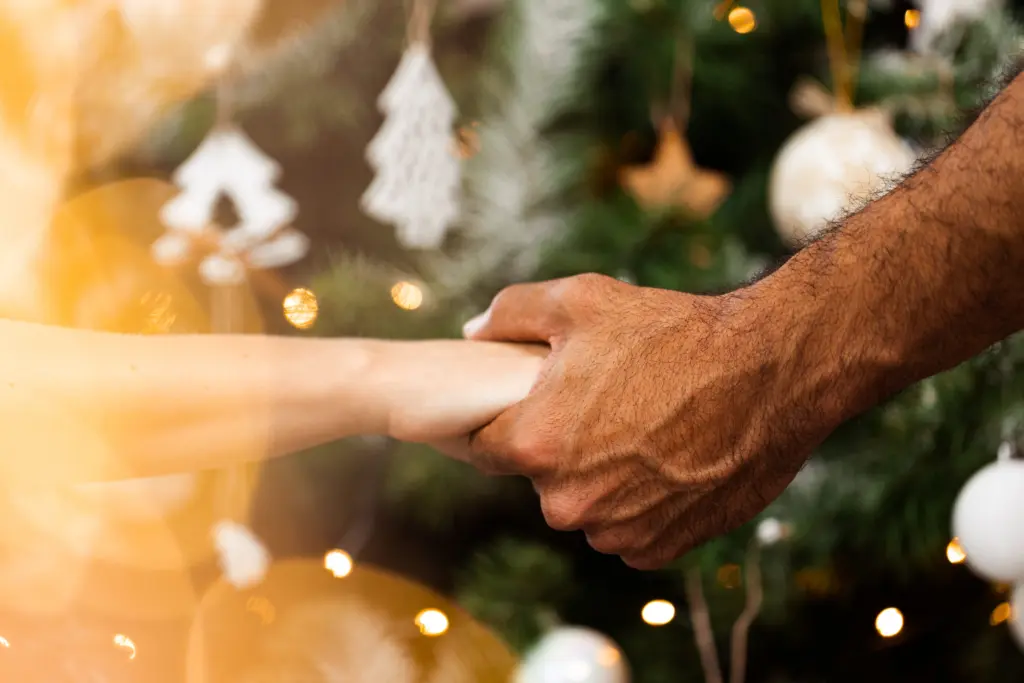 Close up photo of male hands holding Christmas gift box