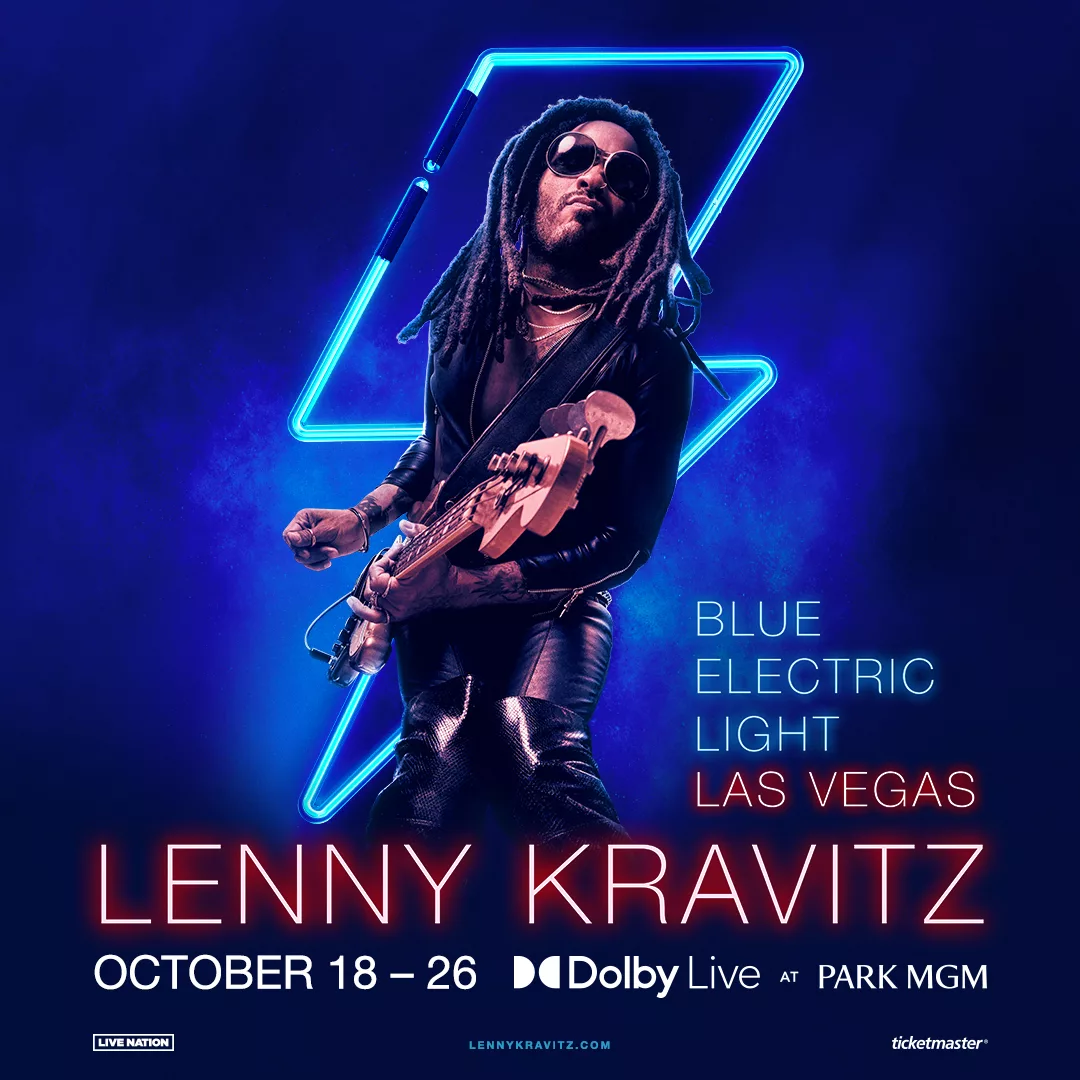 Lenny Kravitz with a guitar with blue lightning in background