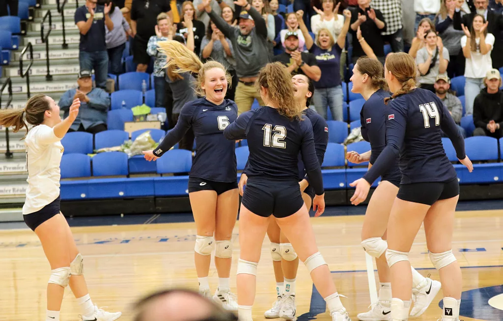 Oregon Tech volleyball celebrates a point