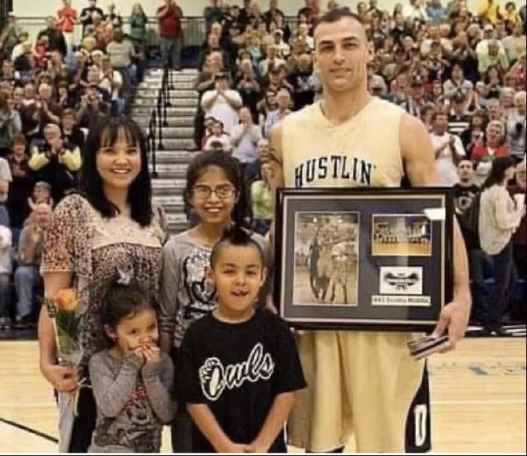 A young Scotty Riddle Jr. with his family during his father's senior night