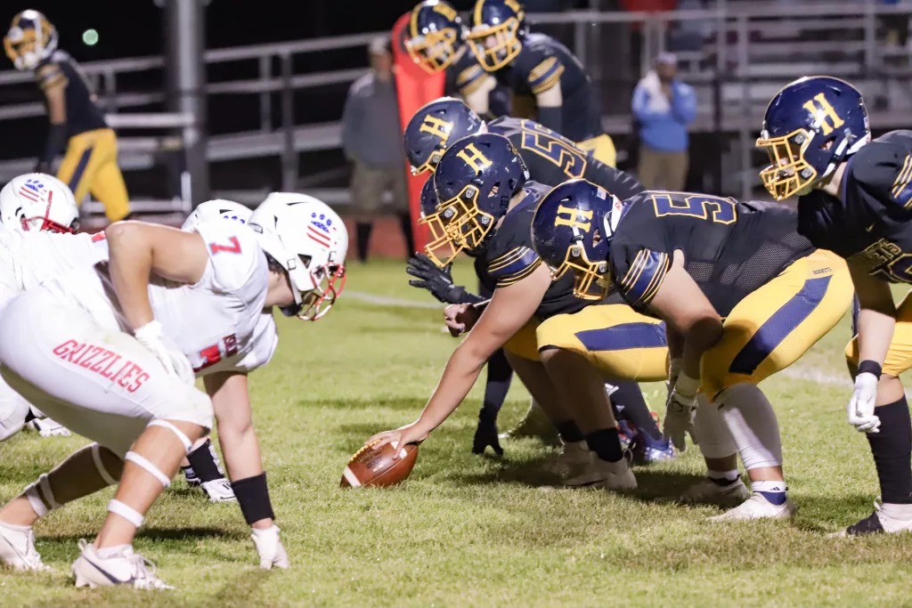 Henley preparing to snap the ball