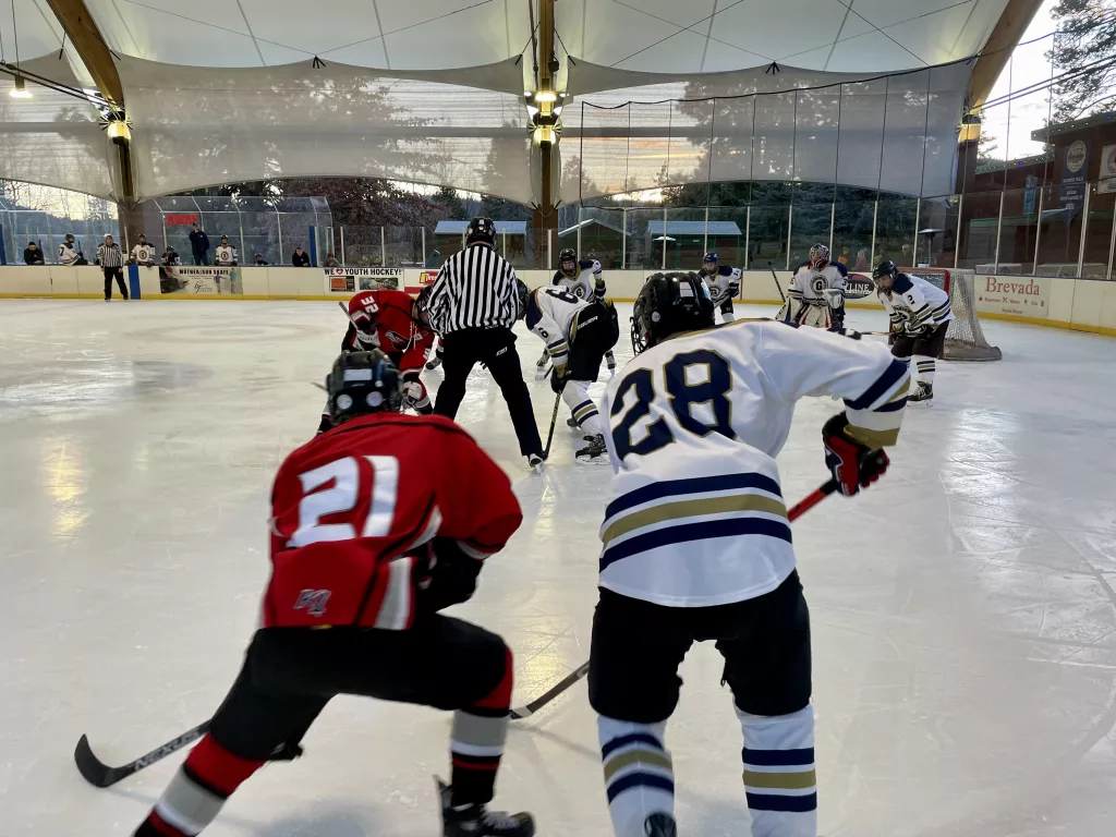 The Klamath Falls Ice Hawks line up for a faceoff against the Eugene Jr. Generals