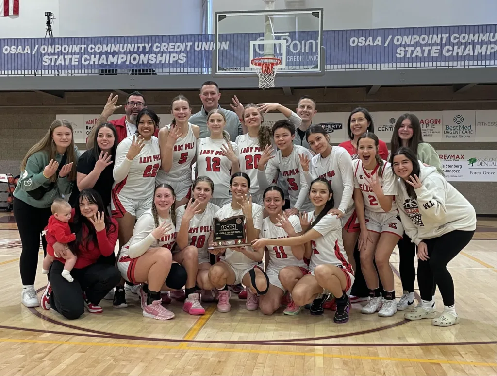 The Klamath Union girls basketball team with the fourth place trophy