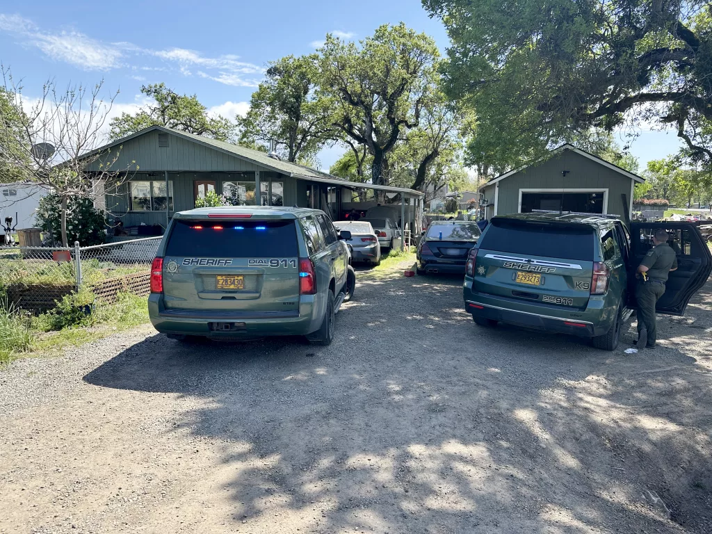 Jackson County Sheriff's cars outside a house