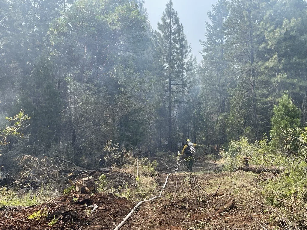 A firefighter working on the Salt Creek Fire