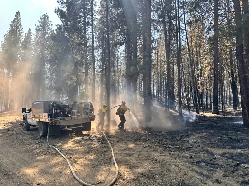 Firefighters spraying part of the Copperfield Fire