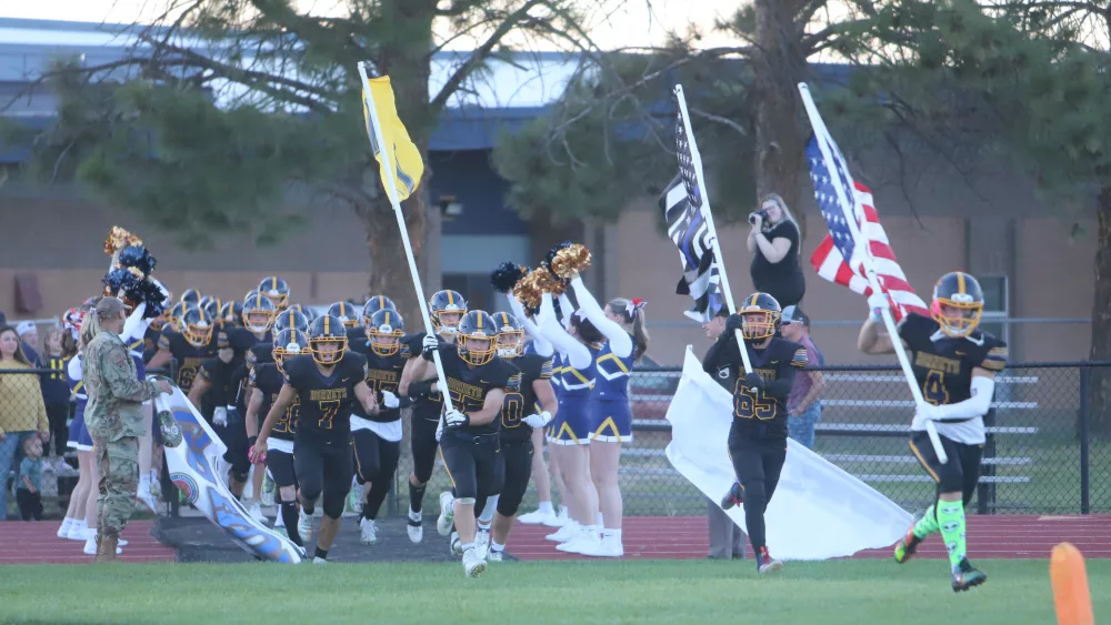 Henley football running out before a game