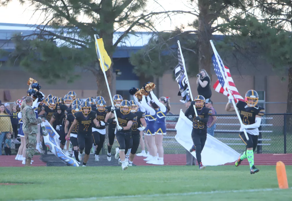 Henley football running out before a game