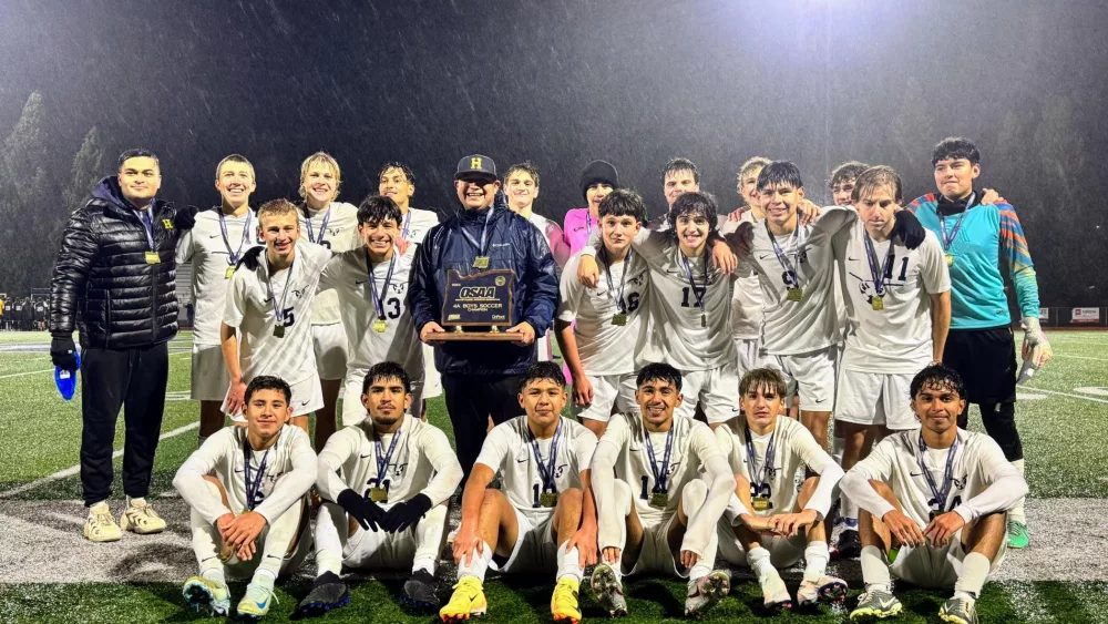 Henley Boys Soccer with the state championship trophy