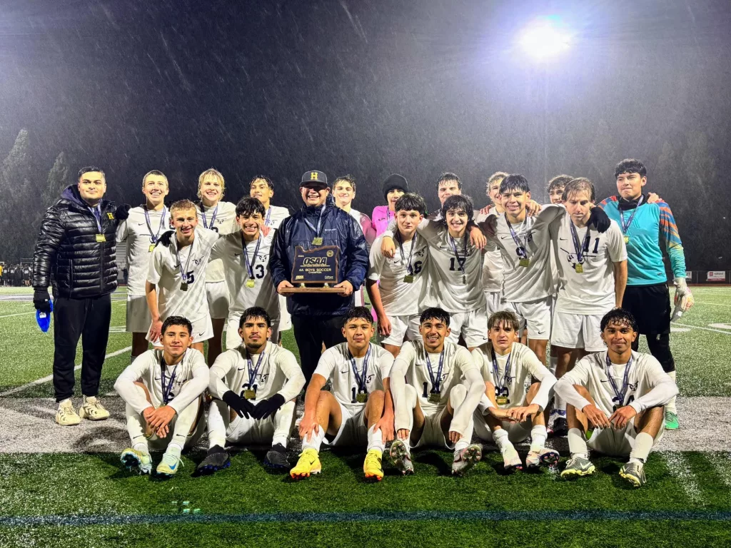 Henley Boys Soccer with the state championship trophy