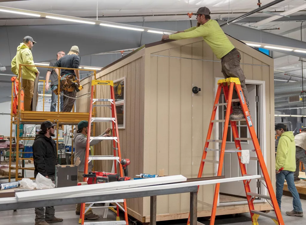 Students in the Klamath Community College Apprenticeship and carpentry program work on a small cottage that will be used to house displaced people from recent wildfires outside of Chiloquin last summer
