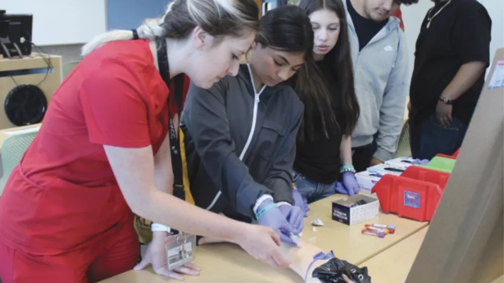 Area high school students try their hand at drawing blood during a Career Day demonstration on the KCC campus last spring