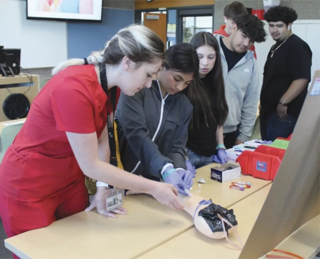 Area high school students try their hand at drawing blood during a Career Day demonstration on the KCC campus last spring