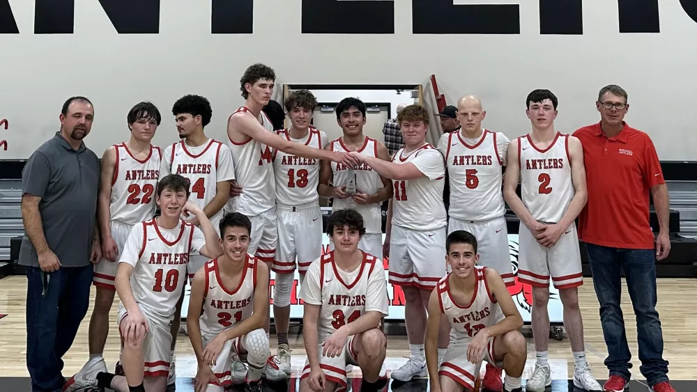 The Bonanza boys basketball team with the Antler Classic trophy