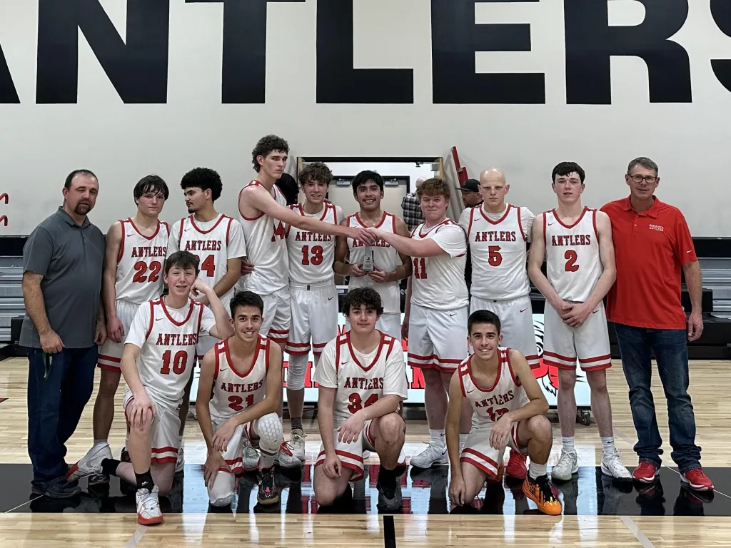 The Bonanza boys basketball team with the Antler Classic trophy