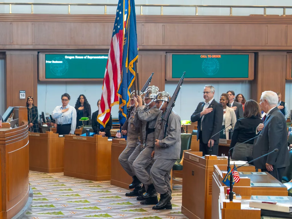 Cadets from the Oregon Youth ChalleNGe Program present the colors in the Oregon State House chamber at the State Capitol on Tuesday, March 18, 2025. The color guard ceremony opened the day's legislative session for state representatives. The program, administered by the Oregon National Guard, was recently recognized as the first in the nation to receive an "outstanding" rating under new federal evaluation criteria. (U.S. Army National Guard photo by Maj. W. Chris Clyne, Oregon National Guard Public Affairs)