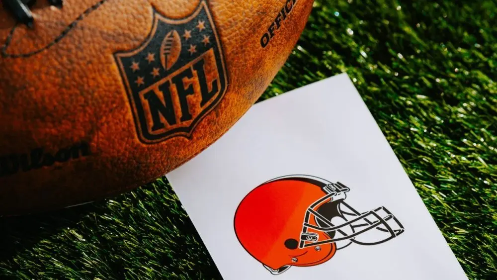CLEVELAND^ USA^ FEBRUARY 10^ 2025: Cleveland Browns NFL team Logo and American football ball on Green Grass.