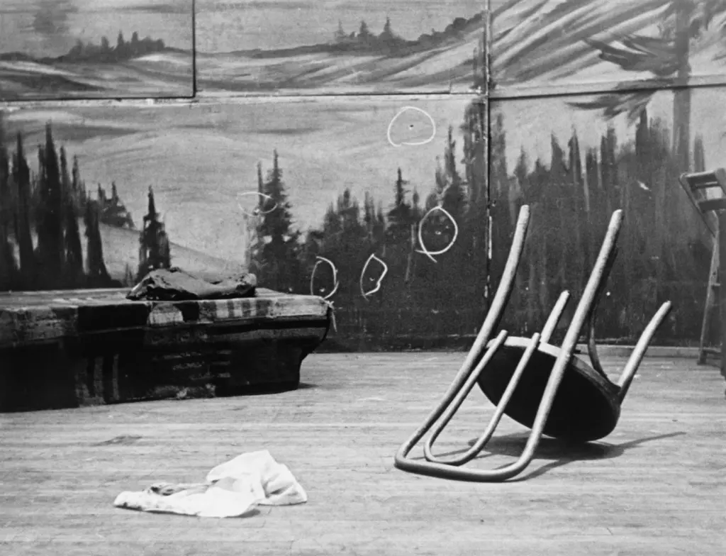 Bullet holes in back of stage where Malcolm X was shot. Photographic print.