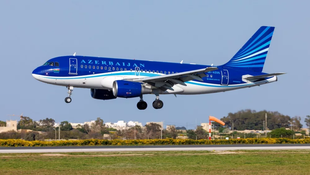 Azerbaijan Airlines Airbus A319-111 (REG: 4K-AZ05) on finals runway 31^ bringing the national football team for a match with Malta. Luqa^ March 23^ 2022