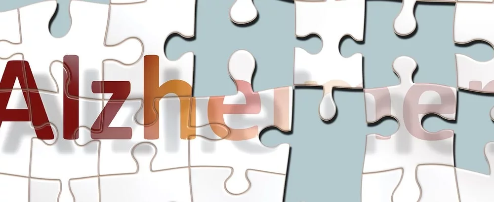 Graphic of a puzzle spelling out Alzheimer's