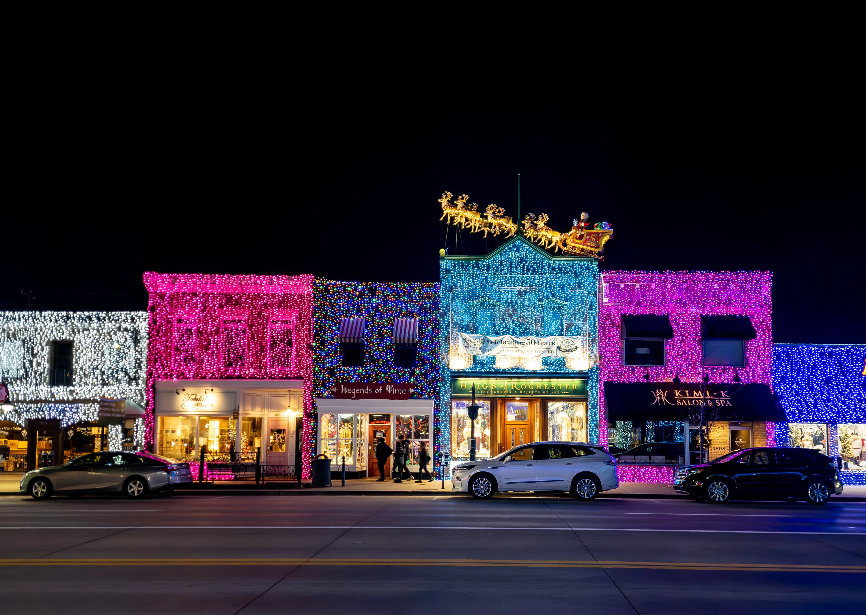 big-bright-light-show-holiday-christmas-lights-on-main-street-rochester-road-in-downtown-rochester-michigan-with-santa-legends-of-time-haigs-of-rochester-kimlk-salon