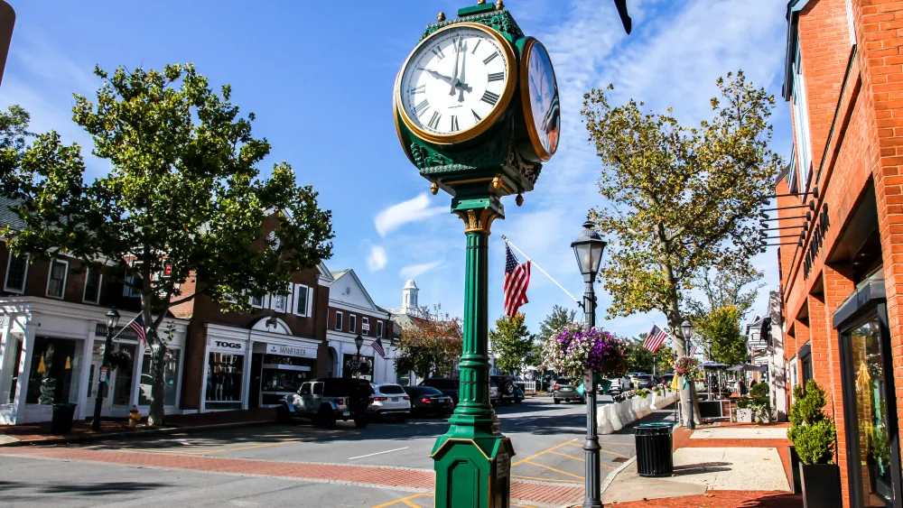 new-canaan-ct-usa-october-4-2020-downtown-in-nice-day-with-clock-store-fronts-restaurant-and-blue-sky-on-elm-street