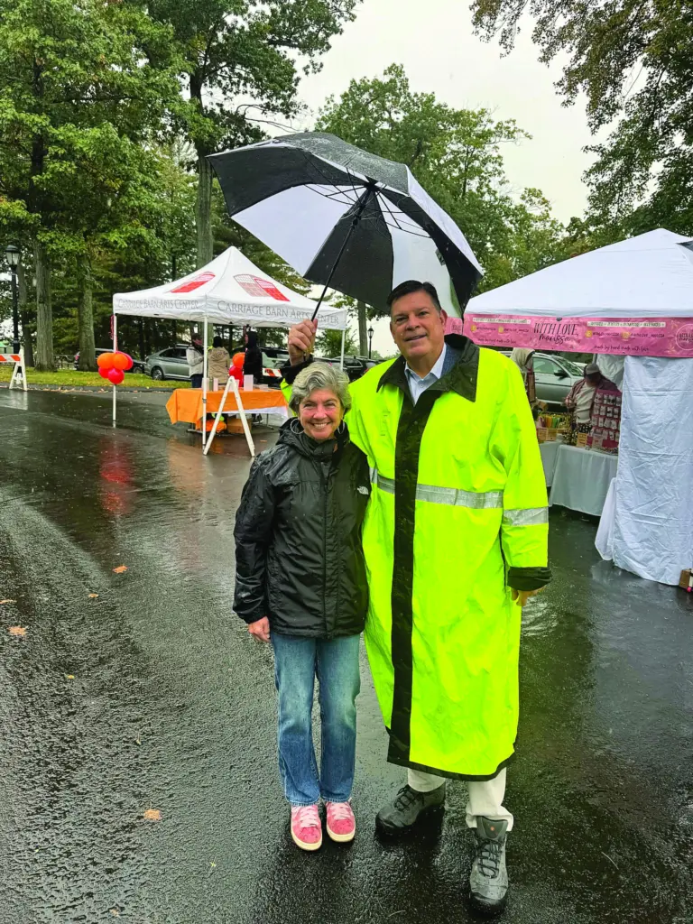 l-r-former-westport-first-selectwoman-jen-tooker-and-rep-tom-odea-braved-the-rain-to-attend-sundays-waveny-park-art-festival-_cmyk_300dpi