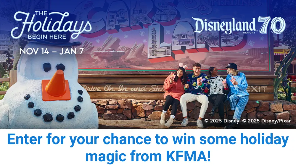 Friends enjoying holiday treats at Cars Land in Disney California Adventure during Disneyland Resort’s 70th Anniversary celebration, with a festive snowman decoration and banner reading ‘The Holidays Begin Here – Nov 14 to Jan 7.’ KFMA holiday giveaway promotion.