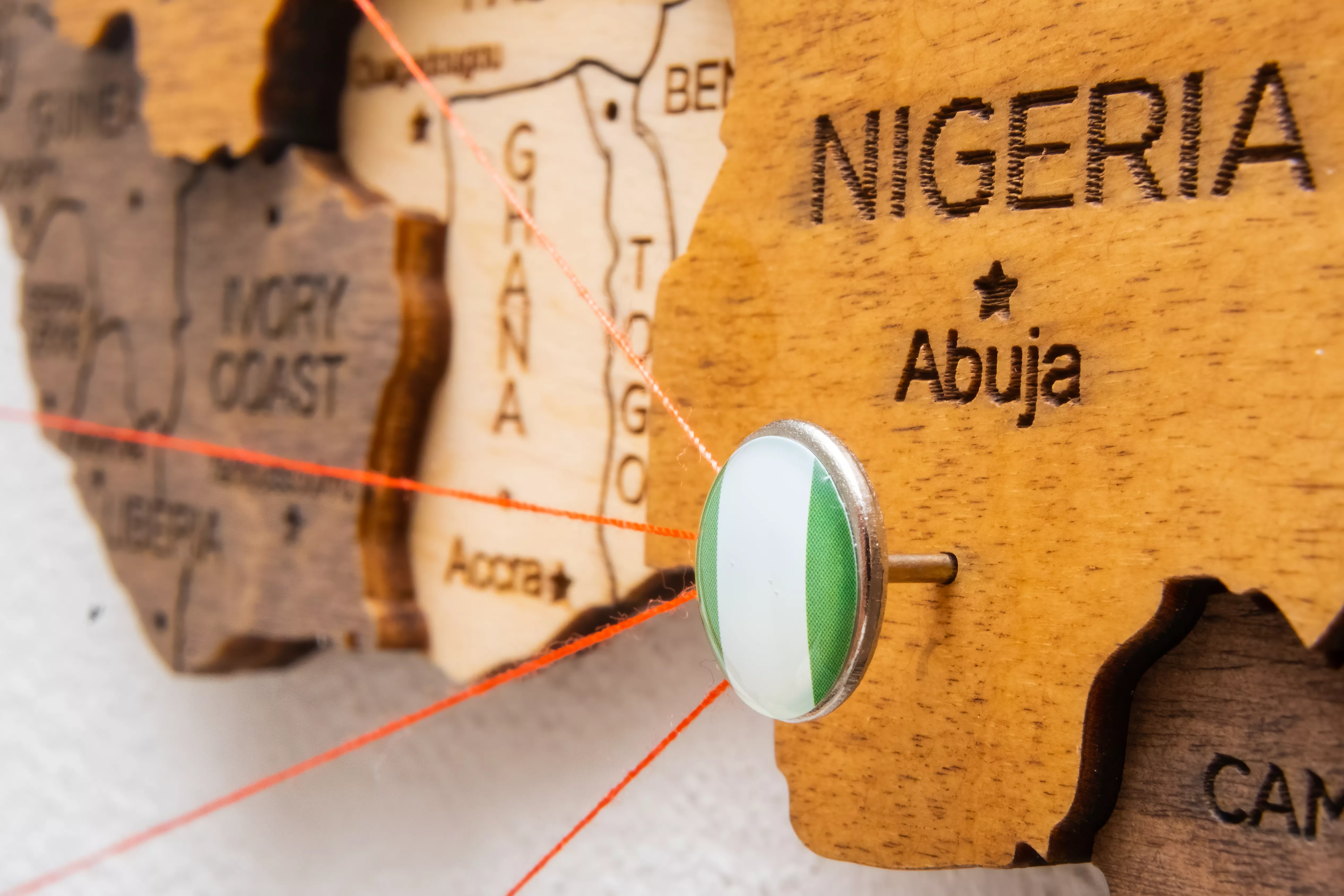 nigeria-flag-on-the-pin-with-red-thread-showed-the-2023-11-27-05-03-54-utc