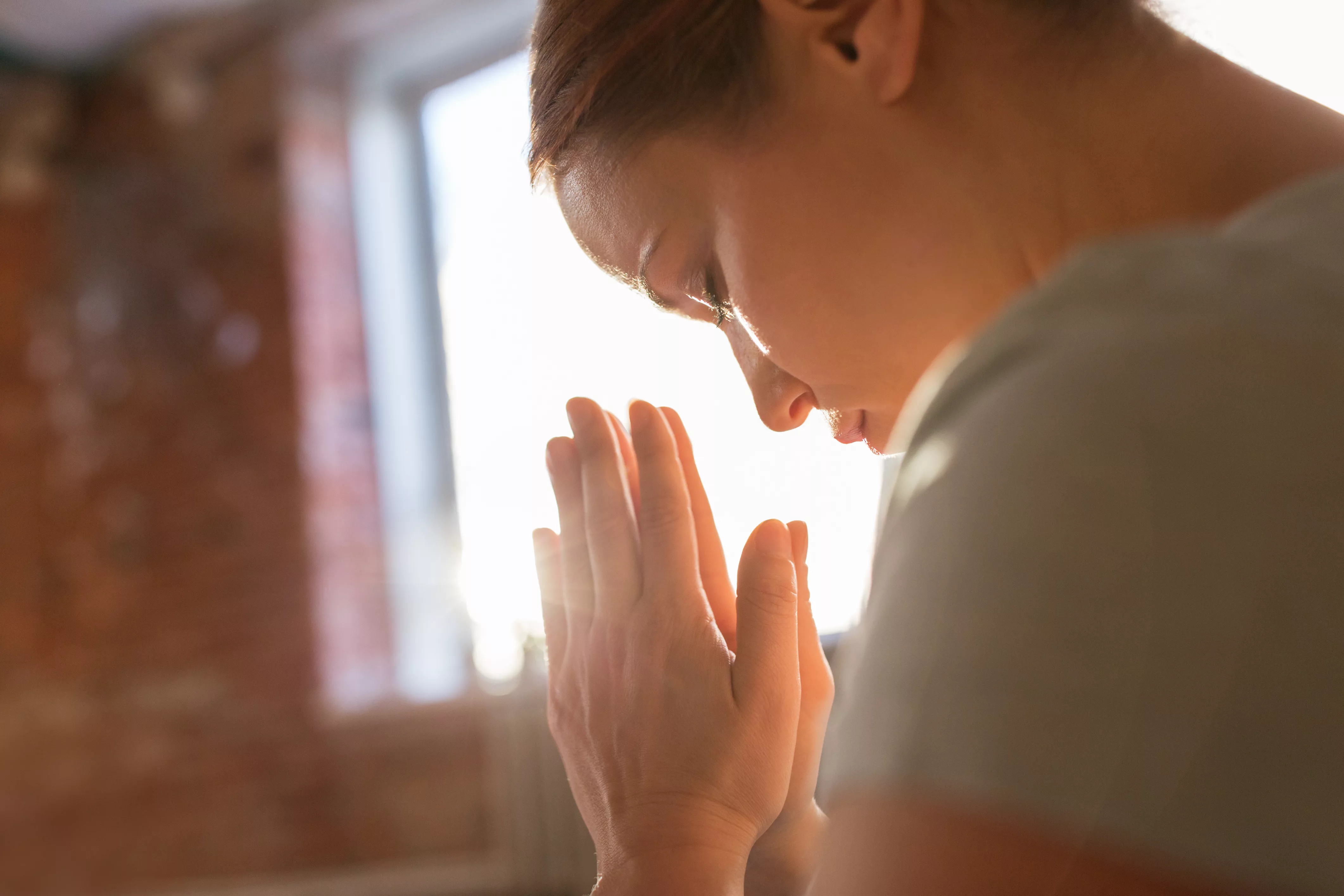 close-up-of-woman-meditating-at-yoga-studio