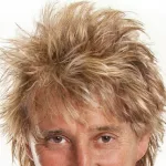 Half headshot of Rod Stewart with his iconic hair style.
