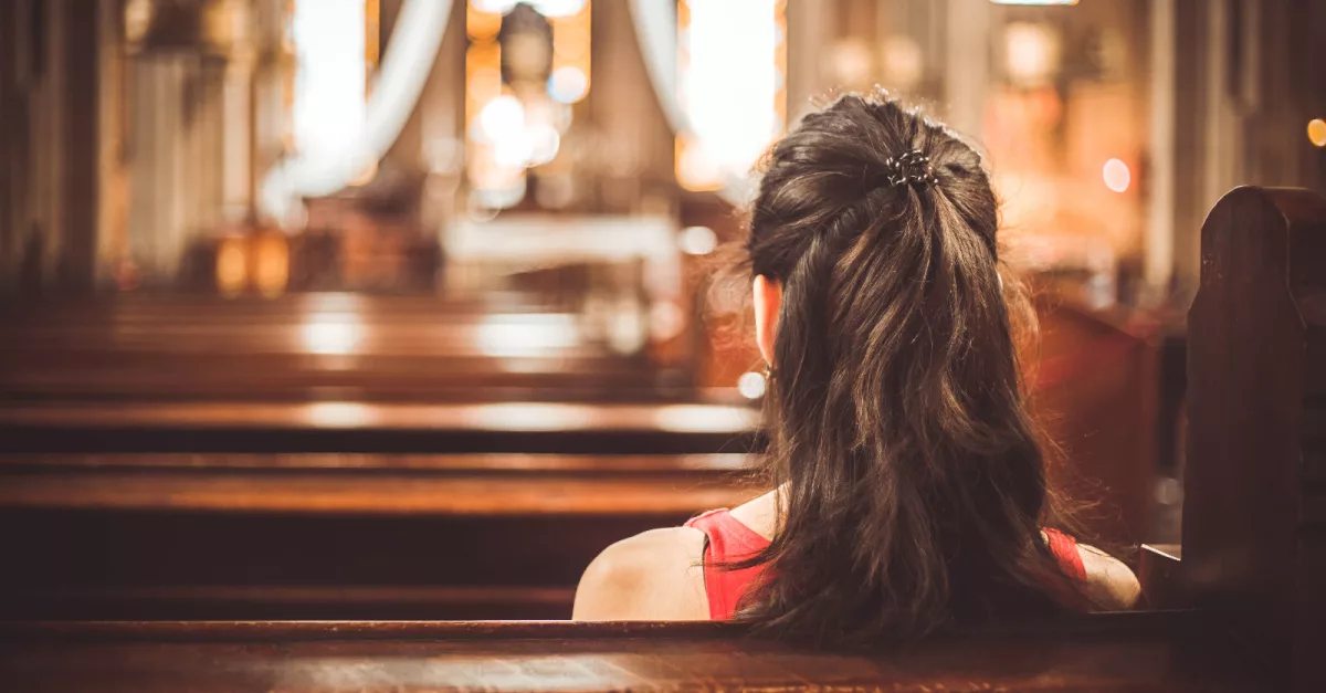 21950-woman-in-church-pew-gettyimages-kadirdemir357987