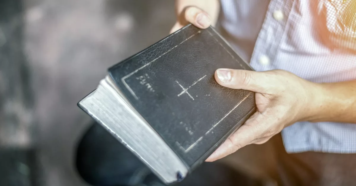 19958-man-holding-bible-gettyimages-boonchai-wedmak127836