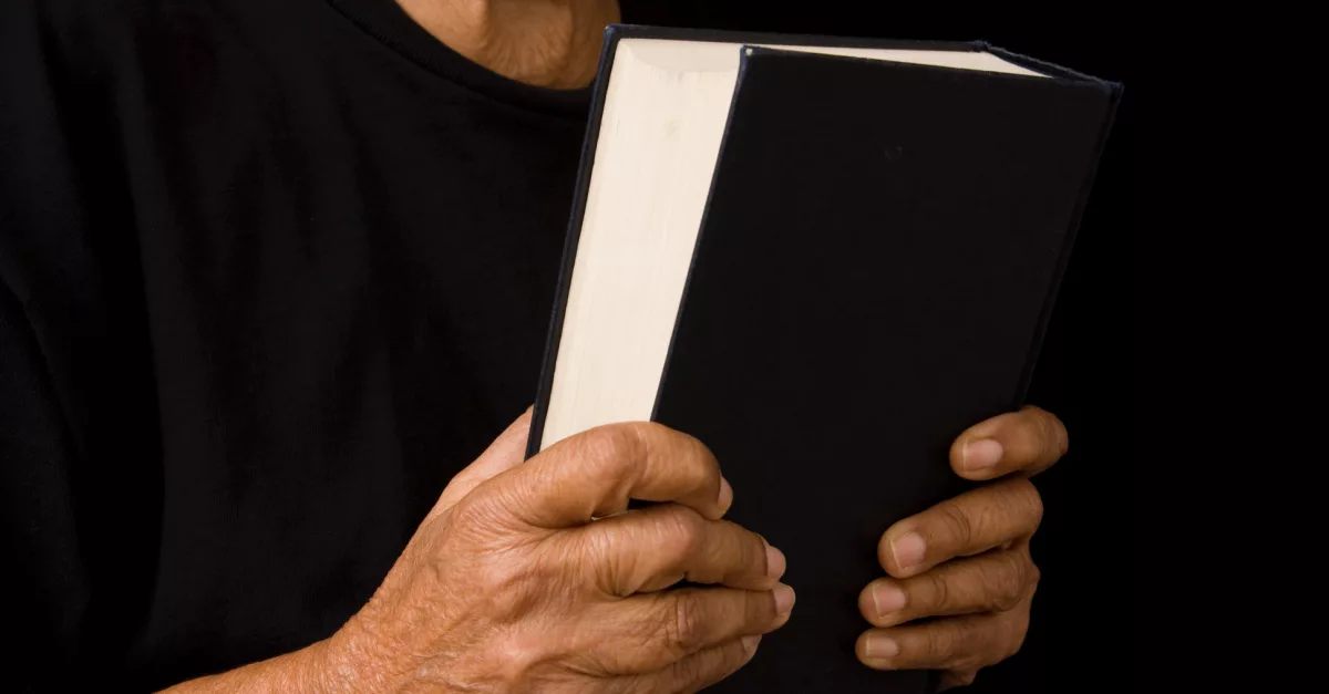 22794-woman-holding-bible-gettyimages-paulmaguire589140