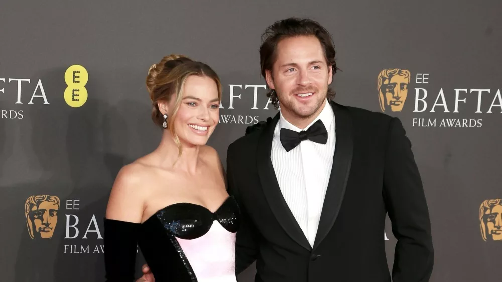 Margot Robbie and Tom Ackerley attend the 2024 EE BAFTA Film Awards at The Royal Festival Hall in London^ England. February 18^ 2024