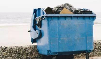 blue-garbage-container-on-the-coast