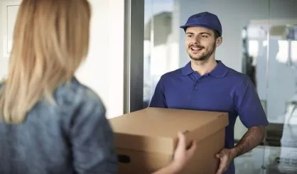 delivery-man-handing-box-to-woman