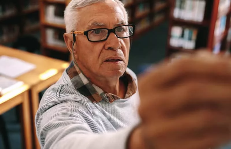 close-up-of-a-professor-teaching-in-classroom-writing-on-board