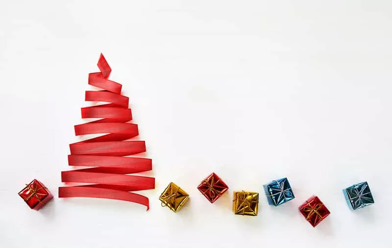 christmas-tree-made-from-red-ribbon-with-small-gifts-on-white-ba-2