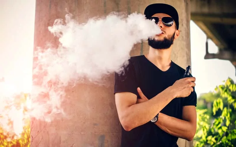 vaper-with-beard-in-sunglasses-vaping-outdoor-2