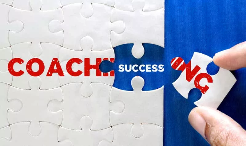 close-up-piece-of-white-jigsaw-puzzle-with-coaching-and-success