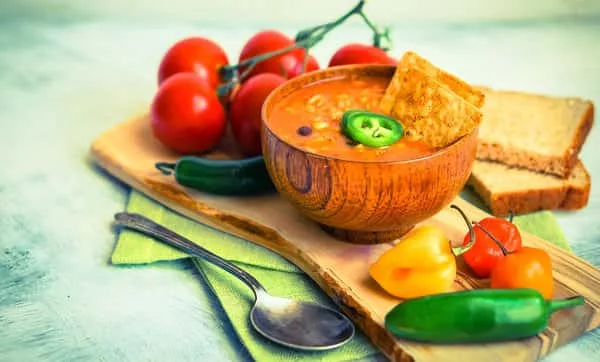 hot-and-spicy-fresh-made-mexican-chili-soup-on-rustic-background